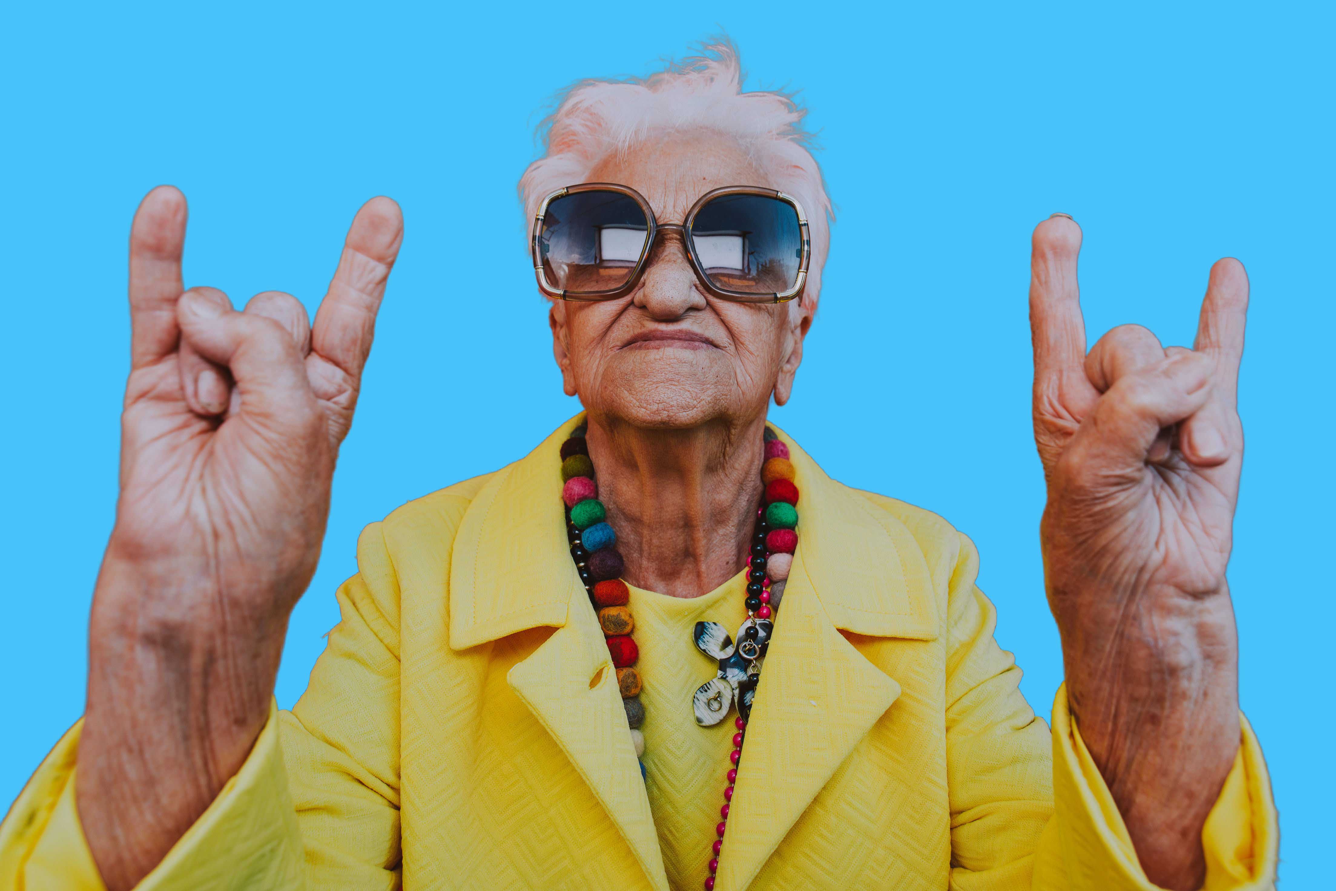 Old-Lady-In-Yellow-Coat-Rocking-Out-Vector-X