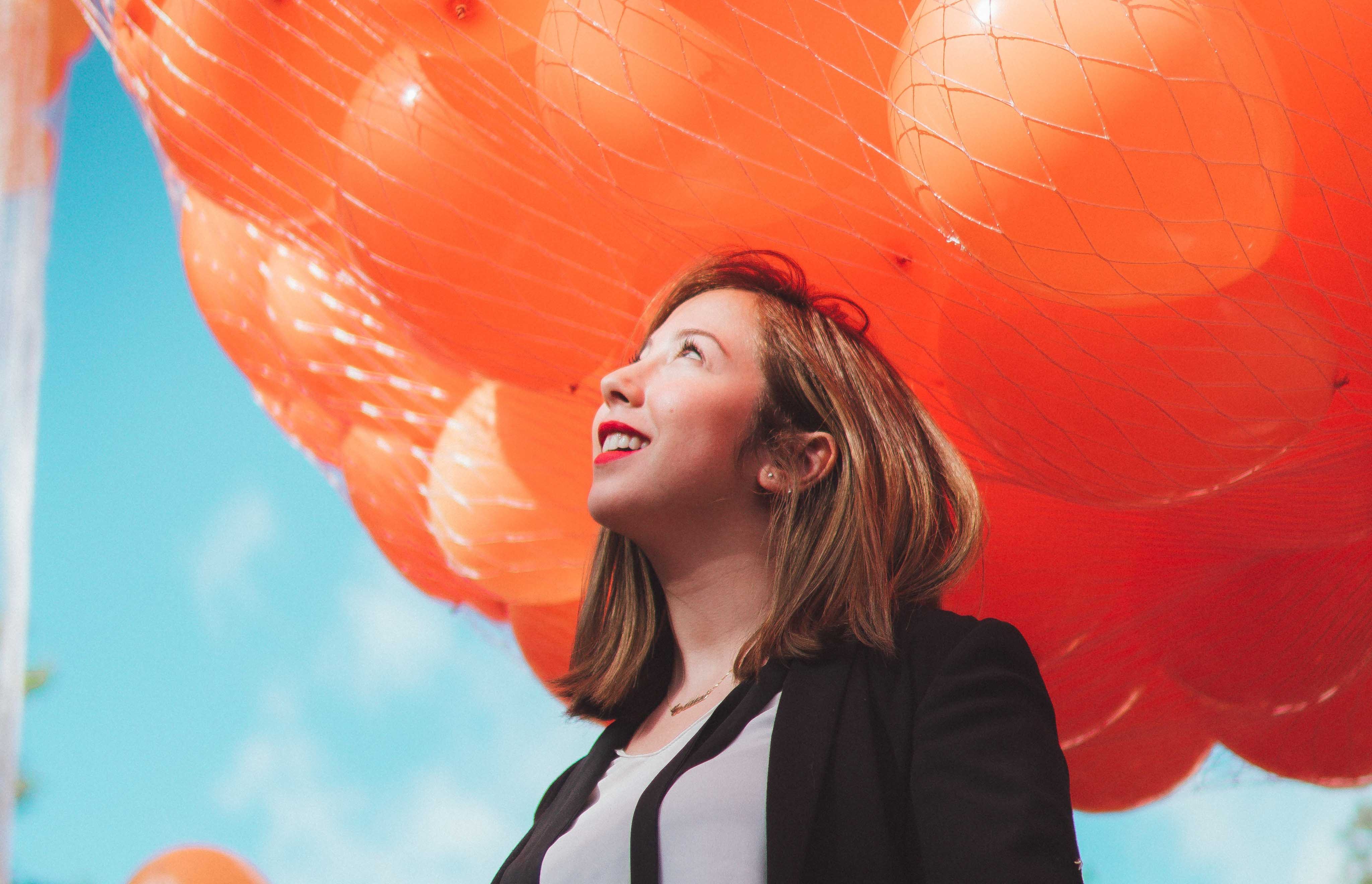 Woman-Looking-Up-At-Balloons-Vector-X